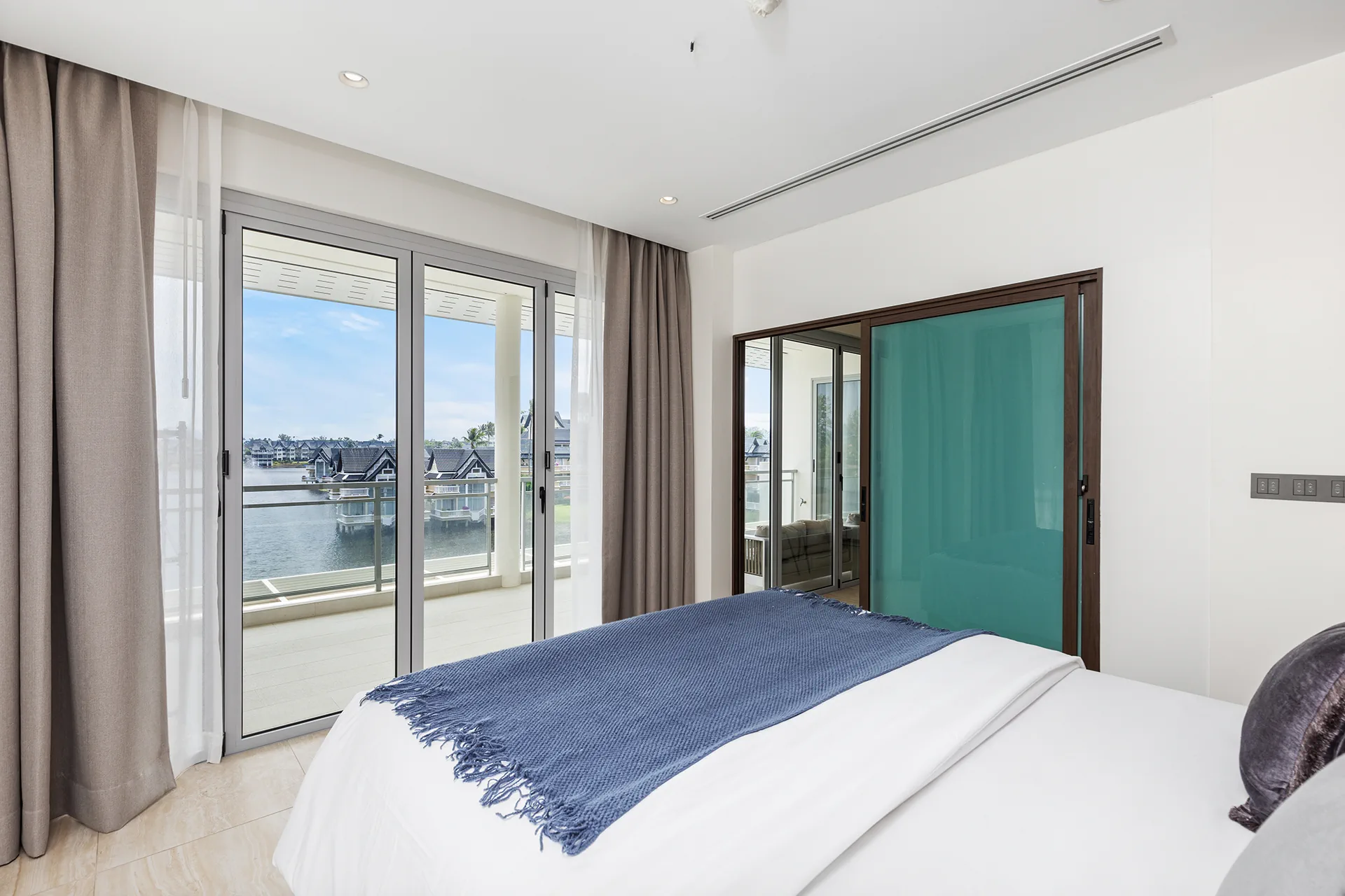 Bedroom with Balcony Access and Lake Views
